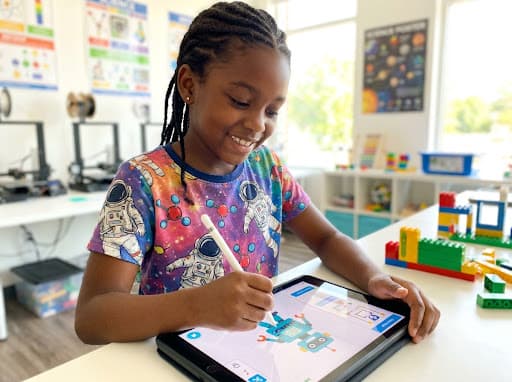 Smiling girl using a tablet